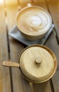 Wooden sugar bowl and coffee late, morning warm light Royalty Free Stock Photo