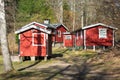 Wooden summer houses for tourists in Sweden. The wooden cabins or huts are painted in traditional Scandinavian red color. Royalty Free Stock Photo