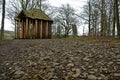 Wooden summerhouse on a forest path Royalty Free Stock Photo