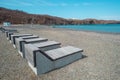 wooden sun loungers on the beach Ahlestisheva in Russky island, Vladivostok