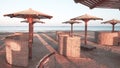 Wooden sun umbrellas, sunbeds and windscreens on beach, color toning applied