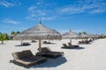 Wooden sunbeds on the tropical beach at Maldives Royalty Free Stock Photo