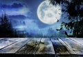 Surface and bats flying in night sky with full moon. Halloween illustration Royalty Free Stock Photo