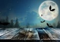 Wooden surface and bats flying in sky with full moon. Halloween illustration Royalty Free Stock Photo