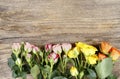 Wooden surface with colorful roses