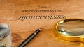 A wooden surface displays a message emphasizing the value of dependability. A magnifying glass and folded currency
