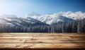 Wooden surface foreground with a magical winter landscape background snow covered pine trees and majestic snow capped mountains Royalty Free Stock Photo