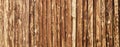 Wooden surface for natural background. Fence made of tree trunks Royalty Free Stock Photo