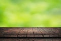 Wooden surface. Painted boards. Old dark table. Wooden table on natural green blurred background Royalty Free Stock Photo