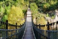 Wooden Suspension Bridge over Valley Royalty Free Stock Photo