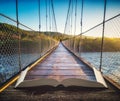 Wooden suspension bridge on the pages of book Royalty Free Stock Photo