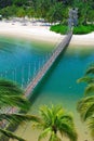 Wooden suspension bridge to paradise island