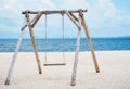 Wooden swing on the beach and Blue Ocean Sea Water Landscape Seascape.,copy space.,Thailand Royalty Free Stock Photo