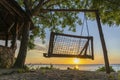 Wooden swing of beautiful sunset on the island of Zanzibar, Tanzania, East Africa Royalty Free Stock Photo