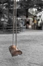 Wooden swing hang by rope at playground