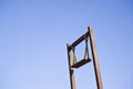 Wooden Swing in the sky. Royalty Free Stock Photo