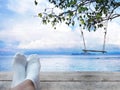 Wooden swing on summer beach background. Royalty Free Stock Photo