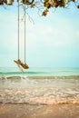 Wooden swing on tropical beach Royalty Free Stock Photo