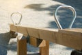 A wooden swing for two children is empty in the park during the epidemic of the Covid-19 virus Royalty Free Stock Photo