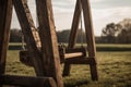 Wooden swings in field. Generate ai