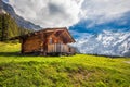 Wooden Swiss chalet in Swiss Alps near Kandersteg and Oeschinnensee, Switzerland, Europe. Royalty Free Stock Photo