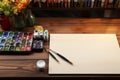 Wooden table adorned with artists essentials, perfect for creative endeavors