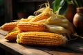 Wooden table adorned with autumns harvest corn creates a rustic still life