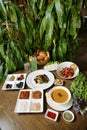 Wooden Table Adorned With Plates of Food