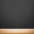 Wooden table against the background of a black wall for chalk. Royalty Free Stock Photo