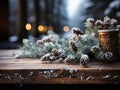 Wooden table against a background of a blurred winter landscape. and on the table there is a fir branch with cones. Royalty Free Stock Photo