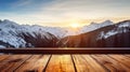 A wooden table against a beautiful background of sunrise scene in the mountains.