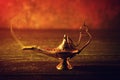 Aladdin lamp of wishes on wooden table