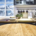 Wooden table background with free space and window and kitchen interior backgound. Winter mountains outside the window. Royalty Free Stock Photo