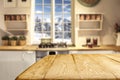 Wooden table background with free space and window and kitchen interior backgound. Winter mountains outside the window. Royalty Free Stock Photo