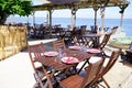 Wooden table on beach terrace for seafood oysters tasting on l`herbe village in Cap Ferret at bay Arcachon basin France