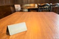 A wooden table and a blank steel plate on it