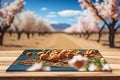 Wooden table and blooming almond garden.generative ai