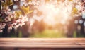 Wooden table in a blooming spring garden