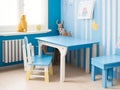 Wooden table in blue children room interior generated Ai.