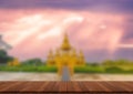 Wooden table and blur of beauty on sunset day and Thai temple