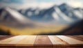 Wooden table on blur mountain morning or evening view landscape, Warm feeling in orange or brown tones