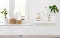 Wooden table on blurred background of kitchen window with utensils