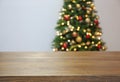 Wooden table and blurred Christmas tree with fairy Royalty Free Stock Photo