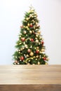 Wooden table and blurred Christmas tree Royalty Free Stock Photo