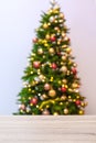 Wooden table and blurred Christmas tree Royalty Free Stock Photo