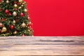 Wooden table and blurred Christmas tree Royalty Free Stock Photo