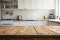 Wooden table with blurred kitchen background Royalty Free Stock Photo