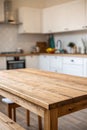 Wooden table on blurred kitchen bench background. Empty wooden table and blurred kitchen background Royalty Free Stock Photo