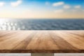 Wooden table on blurred sea Royalty Free Stock Photo