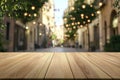 Wooden table with blurred street lights and greenery Royalty Free Stock Photo